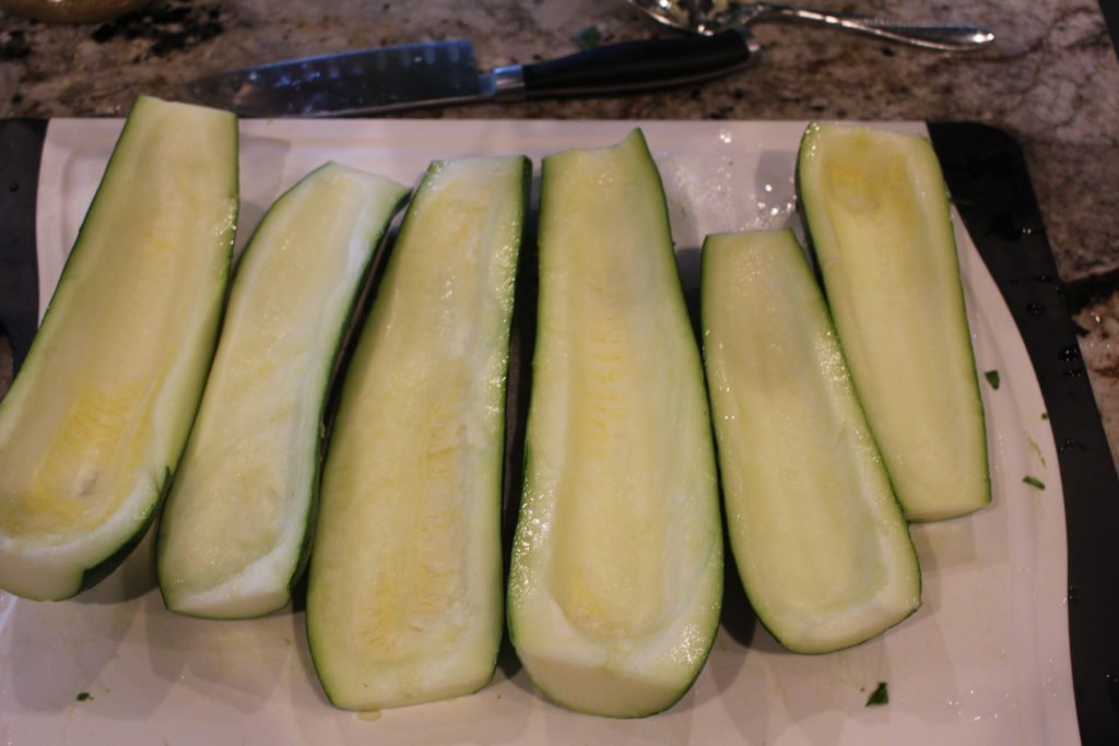 Paleo AIP Stuffed Zucchini Boats -Perfect way to use up all that summer squash & zucchini, not only delicious but pretty too! -www.thehealthnutmama.com