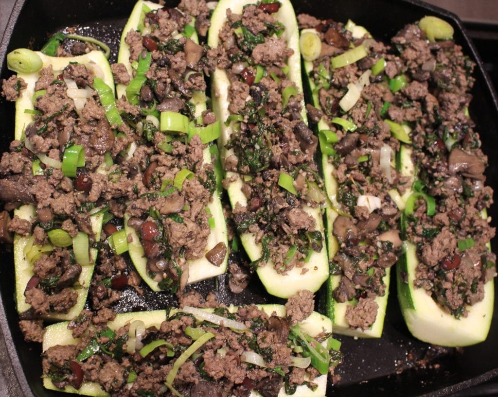 Paleo AIP Stuffed Zucchini Boats -Perfect way to use up all that summer squash & zucchini, not only delicious but pretty too! #aip #paleo #whole30 #keto #lowcarb #glutenfree #zucchini #thehealthnutmama