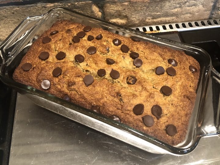 This Paleo Chocolate Chip Banana Bread is so easy & delicious to make. A great way to use up over ripe bananas & satisfy those chocolate cravings at the same time. Gluten Free, Grain Free & Dairy Free. A healthy alternative to the traditional Banana Bread. #paleo #glutenfree #dairyfree #bananabread #chocolatechip #chocolate #healthy #thehealthnutmama