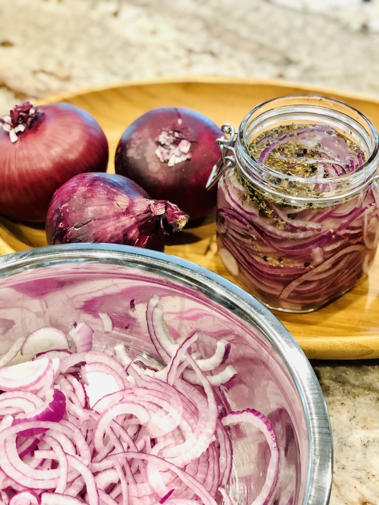 Fermented Pickled Red Onions are so easy to make & oh so healthy. I love them on salads & burgers or chopped up in tuna salad. Another great way to get in those gut healthy probiotics! #fermentedredonions #pickledredonions #ferment #pickle #redonions #onions #aip #paleo #whole30 #vegan #leakygut #guthealthy #probiotics #probiotic #thehealthnutmama